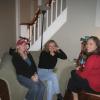 Robin, Aga, and Melanie in the living room of Nicki's three-floor house
